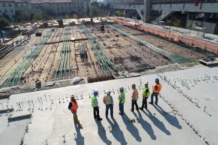 seven construction workers standing seven construction workers standing on white field